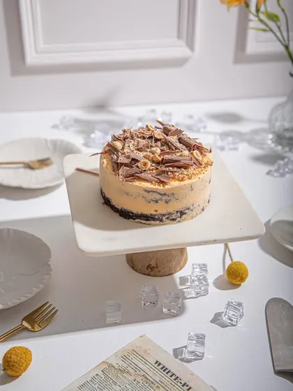 Another angle of our Mango and Chocolate ice cream cake, highlighting its rich texture and delicious toppings.