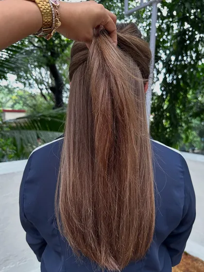 A classic 'Ash Blonde'. This is a great option for those who want to go lighter but prefer cooler tones over warm, golden shades. It's sophisticated and chic.
