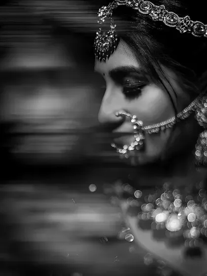 An artistic black and white bridal portrait using a motion blur effect. The result is a dreamy, emotional image with beautiful bokeh.