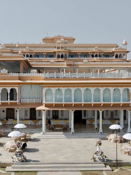 The stunning architecture of the Fateh Vilas palace in Udaipur served as a royal backdrop for this outdoor wedding. I always aim to integrate the venue's natural beauty into my design.