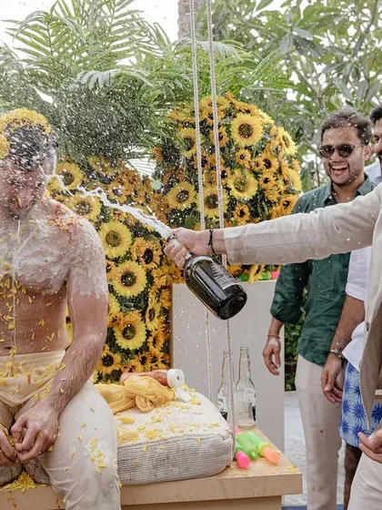 Shivaan gets a cold champagne shower at his haldi. It’s a moment of pure, unadulterated fun among friends, and we love capturing these unexpected and wild celebrations.