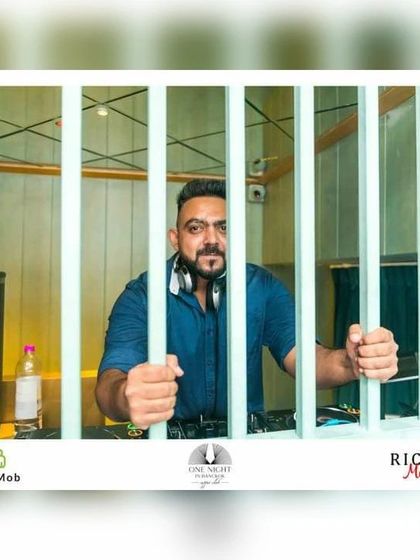 Locked in and ready to drop another classic. A playful shot from the unique DJ console.