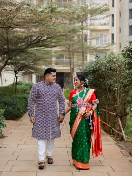 A candid shot of the couple walking and sharing a happy moment together on a paved path, showcasing the relaxed and natural style of my photography.