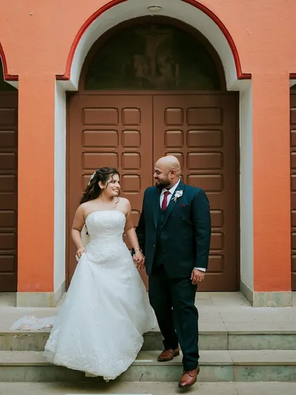 A grand exit from the church. The couple looks happy and in love, ready to start their new life together.