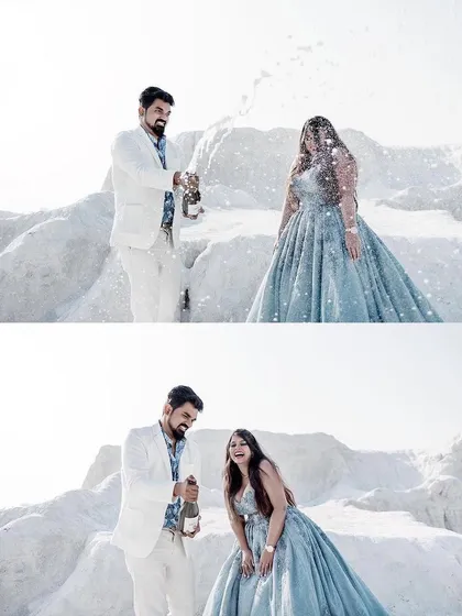 A fun and celebratory moment from our clients' pre-wedding shoot. Popping champagne in our dusty blue ball gown, they are creating memories that will last a lifetime.