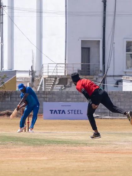 We bring corporate sports to life with professional tournament management. This action shot from the Indian Corporate Cricket League shows our on-field execution, complete with prominent branding for sponsors like Tata Steel.