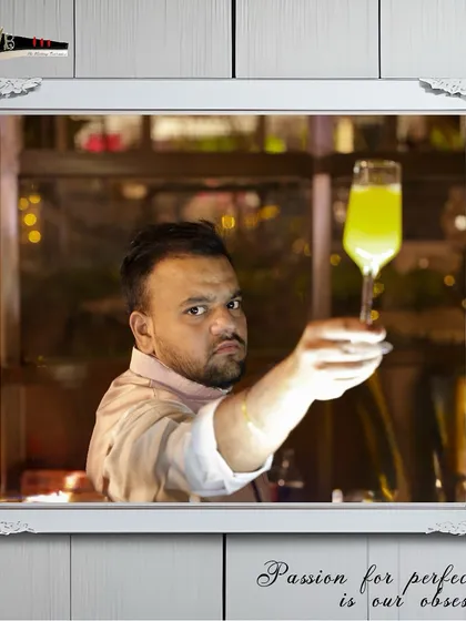 A bartender raises a glass, toasting to a successful Sufi Night event where our mocktails were a huge hit.