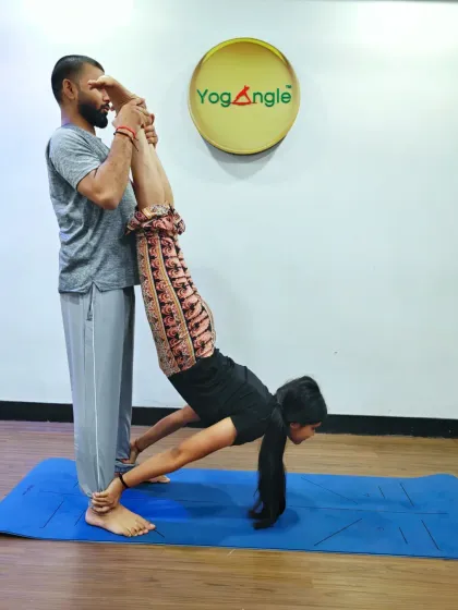 Partner yoga is a beautiful way to build trust, connection, and balance. Here, I am assisting a student in an Acro Yoga pose, creating a fun and supportive experience.
