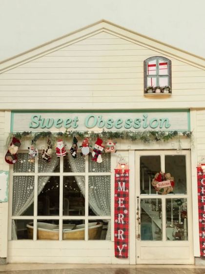 Our storefront all dressed up for Christmas. With stockings, wreaths, and "Merry Christmas" banners, it's a warm and festive welcome for all our guests.