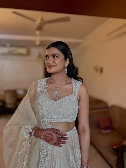 Another angle of this chic open hairstyle. The subtle waves add just the right amount of glamour for a wedding reception.