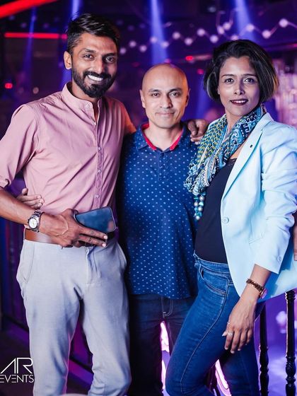 A group of friends posing for a photo.