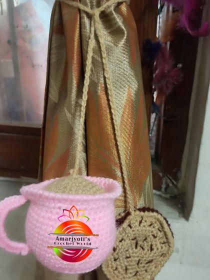 For all the coffee and tea lovers, I designed this curtain tie-back shaped like a pink teacup with a biscuit. It's a quirky and fun addition to a kitchen or dining area.