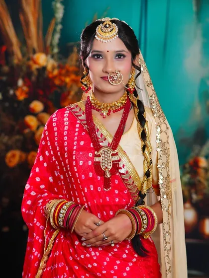 A full view of the Rajasthani bridal look, showcasing the unique draping of the saree and the complementary makeup that enhances the model's features.