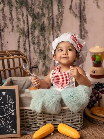 Cooking up some cuteness in the studio kitchen. Themed shoots like this 'Little Chef' session are a wonderful way to capture your child's curiosity and playful spirit in a creative setting.