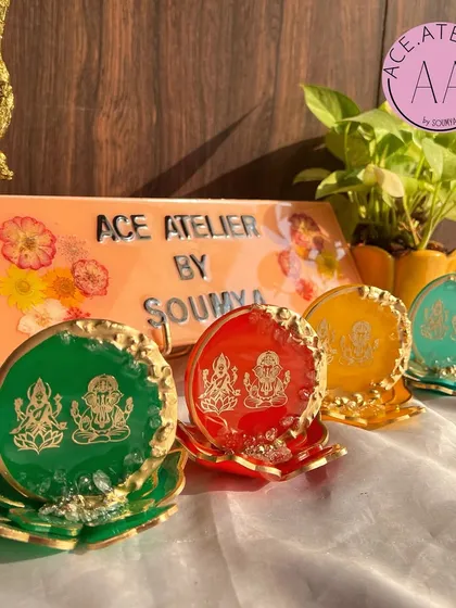 My resin Lakshmi Ganesh standees are available in a variety of auspicious colors like green, red, yellow, and turquoise. Each one sits on a lotus base, making it a beautiful addition to any pooja space or office desk.