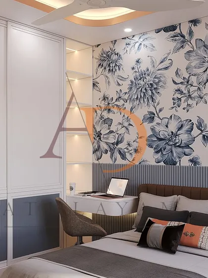 The other side of the room features a bold blue floral wallpaper behind the bed and an integrated study desk with backlit shelving.