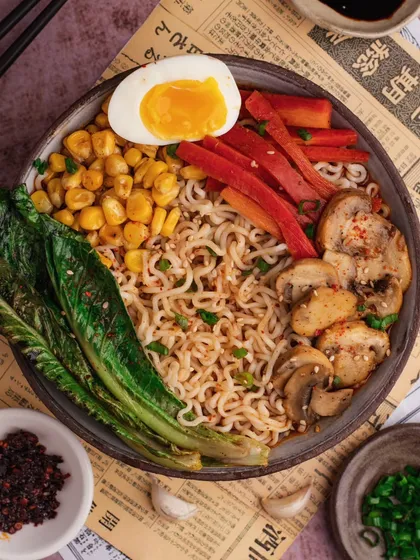 A top-down shot of a fully loaded ramen bowl. This flat-lay style is great for showing all the different components of a dish.