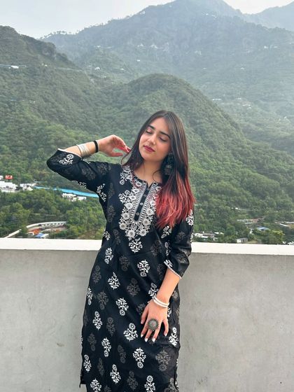A peaceful moment in the mountains, wearing a beautiful black and white embroidered kurta. This shows how I style ethnic wear for travel.