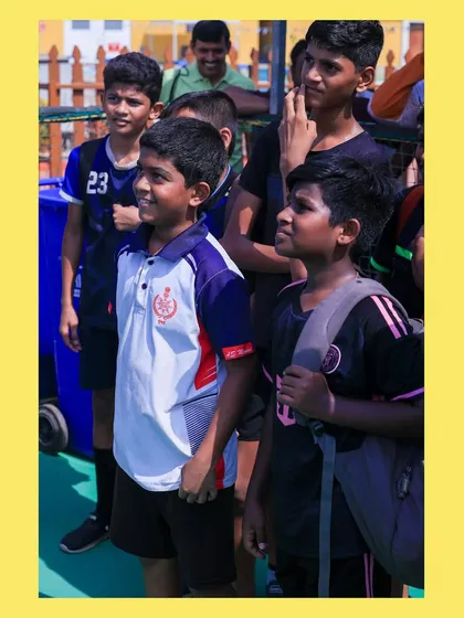 Young athletes watching the drills, waiting for their turn to jump in. The eagerness to play is always high at our camps.