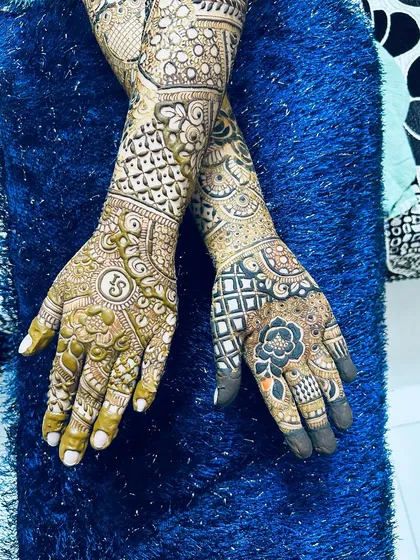 The back of the hands for a full bridal look, featuring personalized initials and intricate patterns.
