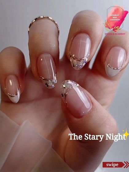 We called this festive design "The Starry Night." It features a clean French manicure elevated with a cascade of silver glitter and a delicate silver line, perfect for any celebration.