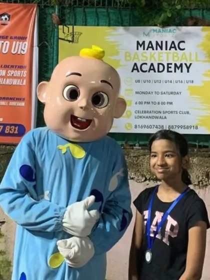 A young player poses with the mascot at "The Carnival." We create a fun and festive atmosphere for the whole family.