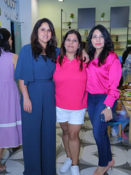 A group of friends enjoying a social event at our venue. It's not just for kids' parties; it's a great place for moms to connect.