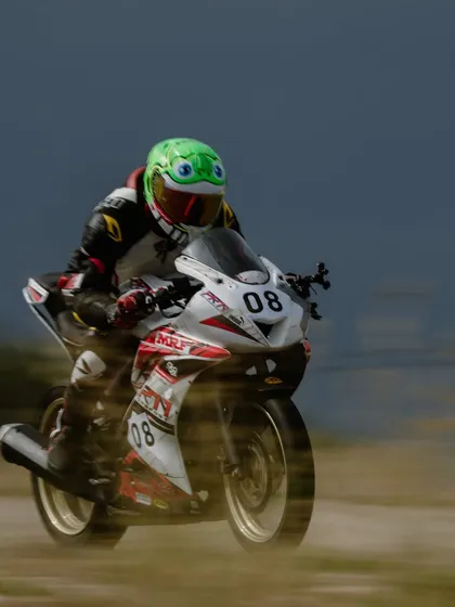 A rider in a unique frog-themed helmet, showing that our community is full of personality. We're all serious about riding, but we have fun doing it.