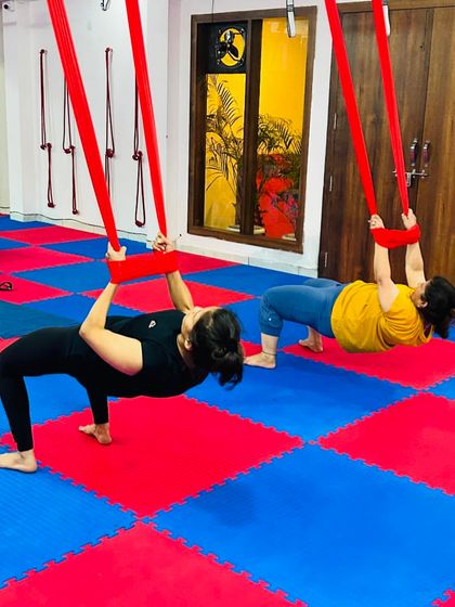 Building strength is a key component of our aerial classes. Students use the hammock for support as they practice variations of suspended planks and push-ups.