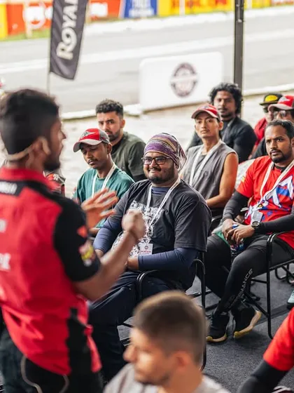 A classroom session during the RE GT Cup Zonal Qualifiers. Our coaching extends beyond the track, with detailed theory sessions covering race strategy, safety protocols, and the technical aspects of motorsport.