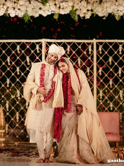 A heartwarming photo of the couple, with the bride resting her head on the groom's shoulder after the ceremony.