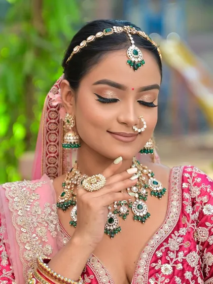This image highlights the full jewellery set, including the statement ring and nath. The glittery eye makeup and nude lip create a perfect balance, letting the jewellery take center stage.