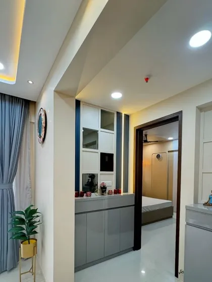 A wider view of the entryway, showing how the custom console fits perfectly into the space, providing both storage and a welcoming first impression.