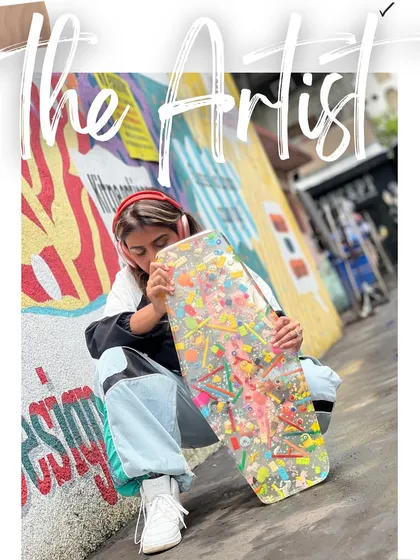 A shot of me on the street with a custom resin skateboard filled with colorful toys. This is part of the 'I Spy' series, showing how we can turn any object into a personal work of art.