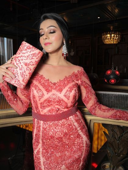 This is a classic look from my Riwayat collection, perfect for an evening party or reception. I focused on a soft, blended smokey eye and a neutral lip to complement the intricate red lace dress, creating a look of pure elegance.