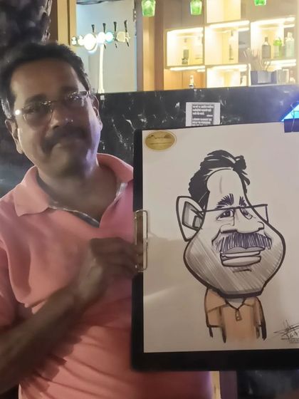 An older gentleman with his caricature.