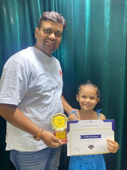 Vidhi Kalvankar proudly holds her award for finishing the Abacus Junior Level. Congratulations on this wonderful achievement!