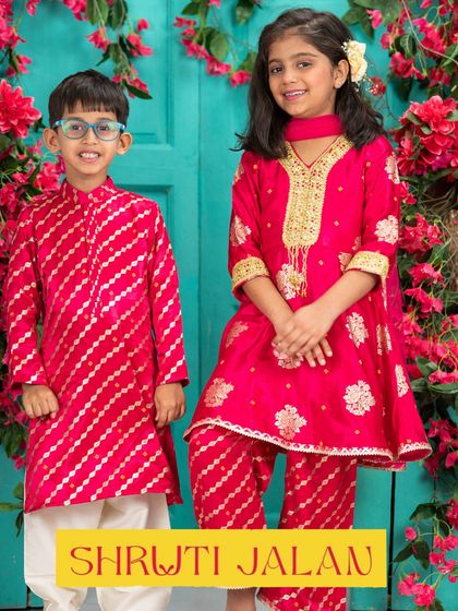 This Rakhi-ready sibling set in bright pink is designed to stand out. The boy's leheriya-style kurta complements the girl's richly embroidered sharara set, creating a vibrant and festive look.