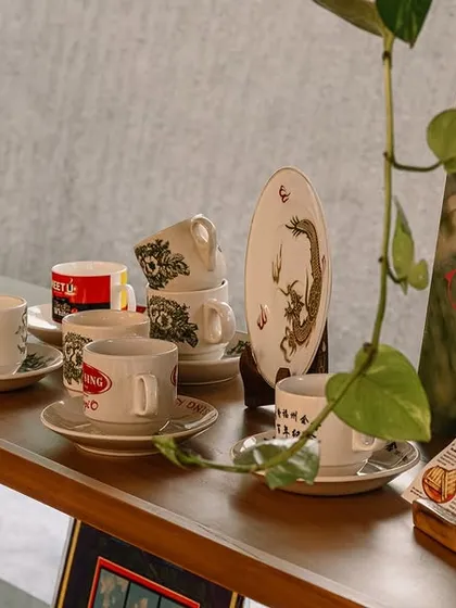 These shelves are filled with little pieces of my past. You can see the traditional Kopi cups, old vinyl records, and other vintage items that I collected. Each one reminds me of the coffee shops I visited as a child in Malaysia.