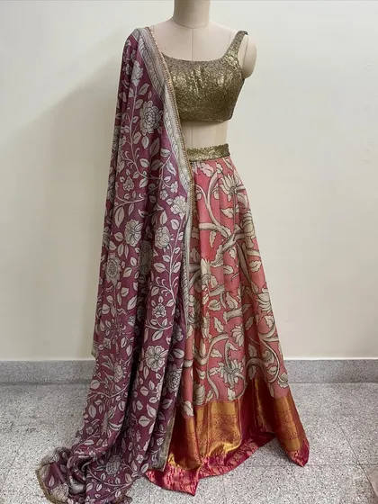 A beautiful lehenga set featuring a floral printed skirt in shades of pink and a contrasting purple dupatta. I paired it with a simple gold sequin blouse.