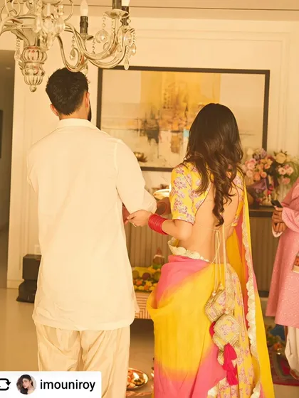 A beautiful abstract landscape provides a serene and sophisticated backdrop during a family ceremony, enhancing the warmth of the moment.