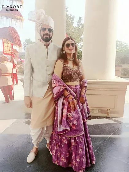 Another shot of this stylish couple, ready for a day wedding. Their coordinated outfits are a perfect example of modern ethnic fashion.