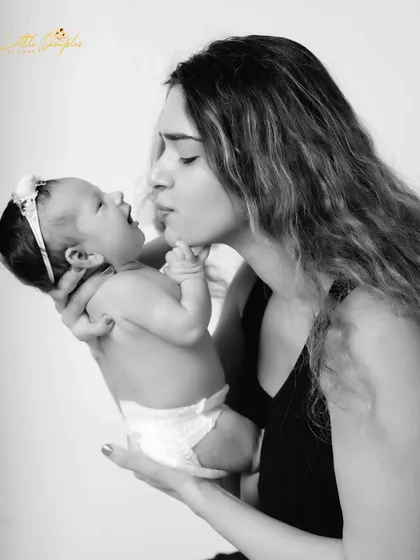 A tender moment between mother and baby, captured in a simple and elegant black and white style. These lifestyle portraits focus on the natural connection and love you share.