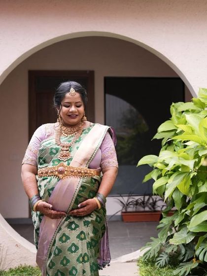 A beautiful shot capturing the mother-to-be's glow. Our sarees are chosen to enhance this special radiance.