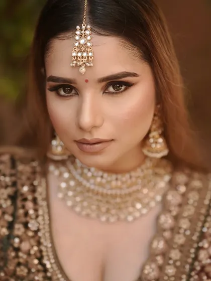 A close-up portrait that captures the flawless, airbrushed-looking skin.