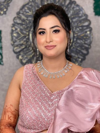 A beautiful portrait of Divisha, looking poised and happy. The soft makeup perfectly complements her pink sequined outfit.