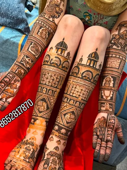 A full view of the bride's hands and legs, covered in beautiful, cohesive mehndi designs that tell a story.