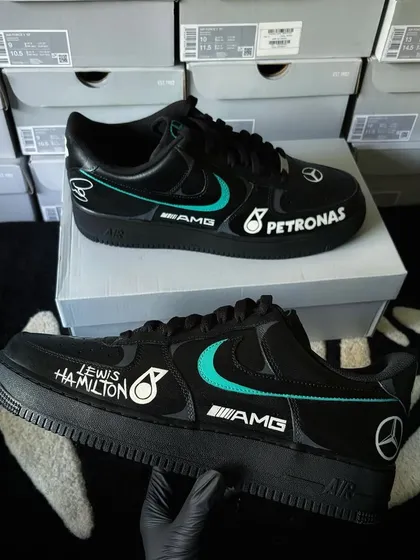 A full view of the Mercedes F1 custom sneakers, with sponsor logos like Petronas and AMG.
