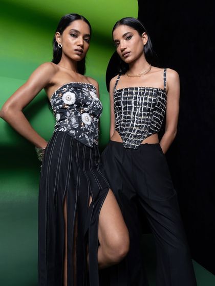 A dual-model shot for Advait, showcasing two coordinated but distinct corset tops. My direction focused on creating a powerful and confident image of modern femininity.