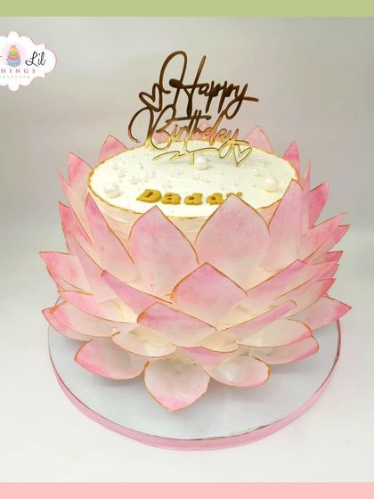 A stunning lotus flower cake for Daddy's birthday. The petals are individually crafted from wafer paper to create a blooming effect.